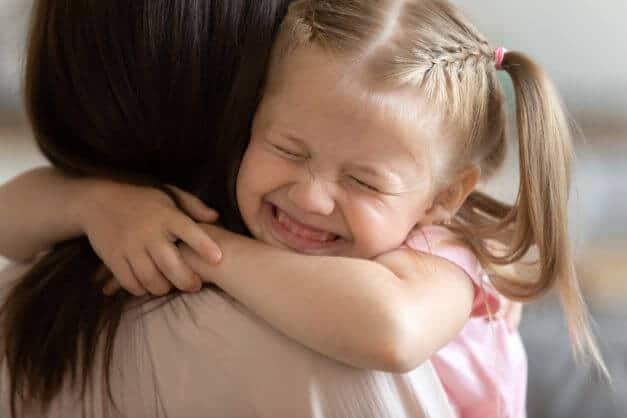child emracing a Foster Parent