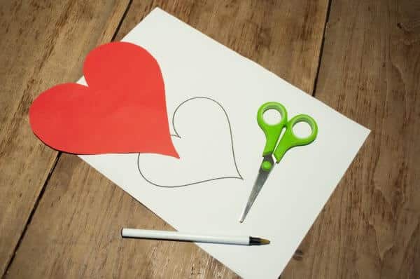 A piece of paper that is in a heart shape as one of the many personalised gifts we can give