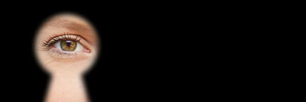 Someone staring through a keyhole