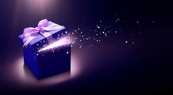 A gift box with imposed sparkles coming from it
