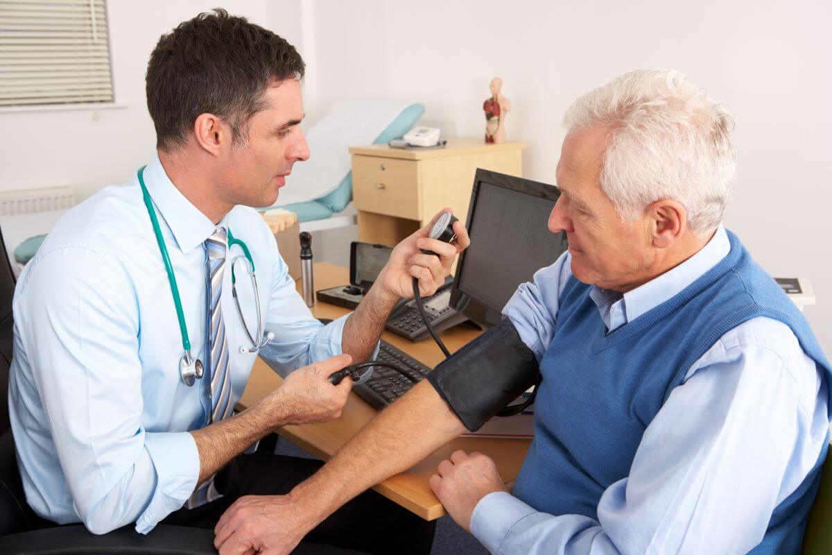 doctor takes patients blood pressure