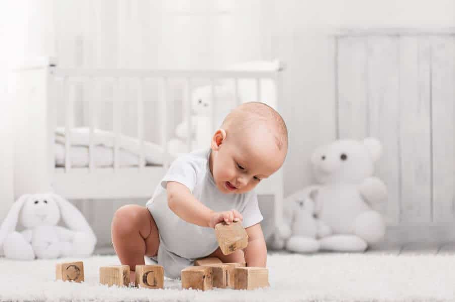 baby playing with blocks