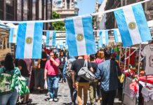 Family Holidays to Buenos Aires: Parks, Museums, Food and City Adventures with Children Buenos Aires / Argentina - 11/10/2019: Famous markets in San Telmo, oldest part of Buenos Aires decorated with Argentinian flags