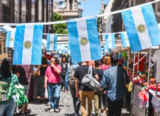 Family Holidays to Buenos Aires: Parks, Museums, Food and City Adventures with Children Buenos Aires / Argentina - 11/10/2019: Famous markets in San Telmo, oldest part of Buenos Aires decorated with Argentinian flags